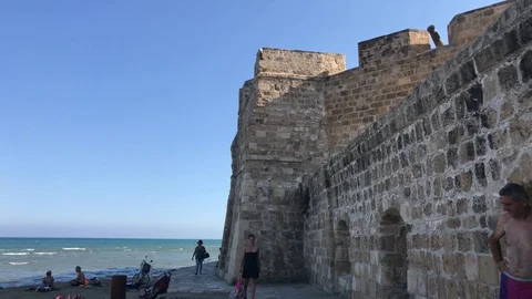 Walking outside of Larnaca Castle Stock Footage 89590703