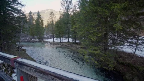 Walking over a bridge looking on a stream Stock Footage 85066137