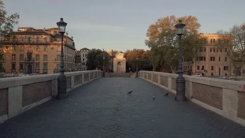 Walking over the empty Ponte Sisto bridge, during sunset, in quiet Rome, Stock Footage 143510736