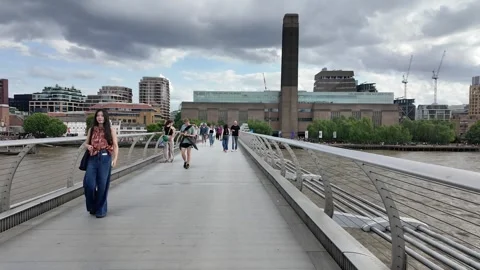 Walking over the Millennium Bridge towards the Tate Modern, London, United Stock Footage 310716651