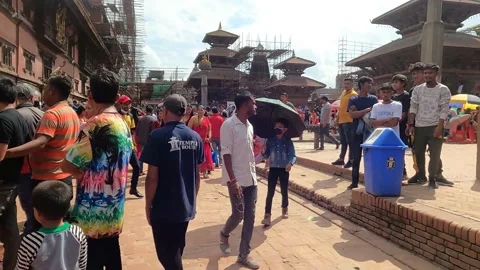 Walking over Patan Durbar Square during Teej festival 스톡 동영상 206232091