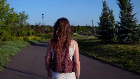 Walking in the park at sunset Stock Footage 92393663