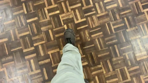 Walking on parquet flooring, continuous moving down angle Stock Footage 146152268