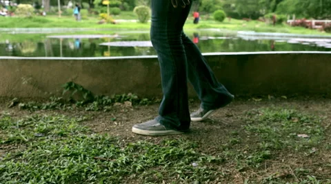 Walking pass pond in grass 스톡 동영상 55692547