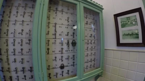 Walking past key cabinet with about one hundred of keys labeled by number 4k Stock Footage 59196061