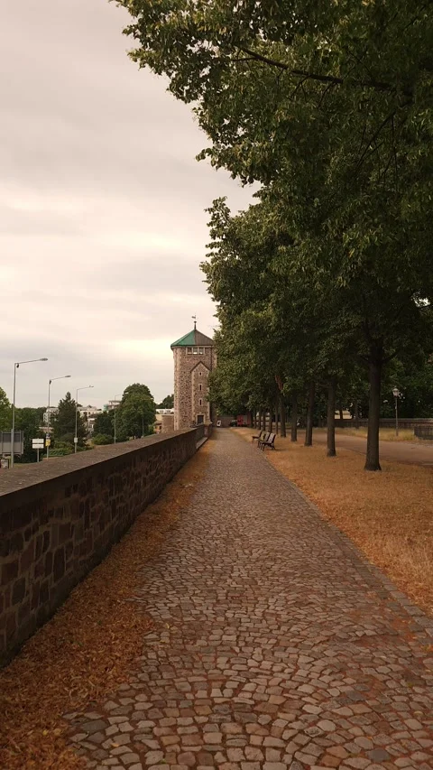 Walking path along old city wall with tower in Germany Stock Footage 340502842