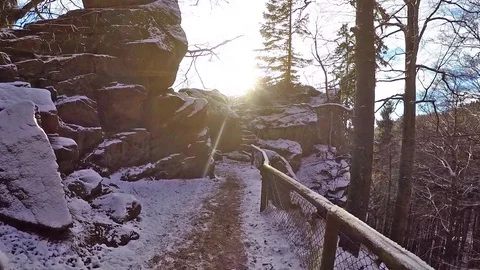 Walking path between heavy stones in Harz Germany to viewing point over forest 動画素材 90311618