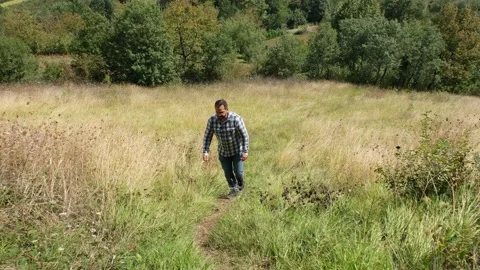 Walking up path Stock Footage 181233944