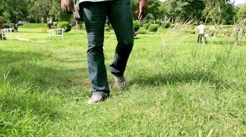 Walking on path grass surrounding 스톡 동영상 55693279