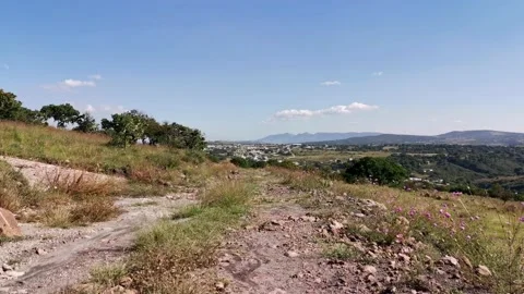 Walking on a path, hiking trail with rocks and grass Stock Footage 220527380