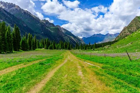 A walking path leads to distant mountains.beautiful natural scenery in Xiata. Stock Photos