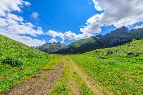 A walking path leads to distant mountains.beautiful natural scenery in Xiata. Stock Photos