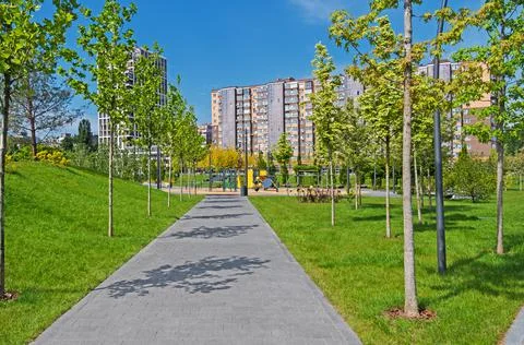 Walking path lined with paving slabs Stock Photos