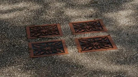 Walking path pattern under a dappled light in the park. Stock Photos