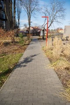 Walking path, paved with tiles. Stock Photos