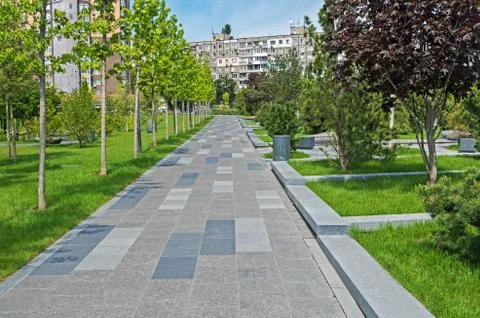Walking path tiled with granite Stock Photos