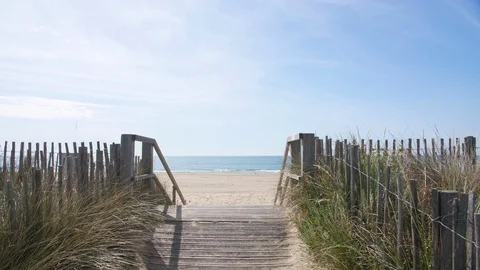 Walking on a path towards the mediterranean sea sandy beach France Sete dunes  Stock Footage 115247511