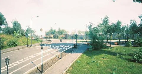Walking path in a tranquil park surrounded by greenery and light posts Stock Illustration