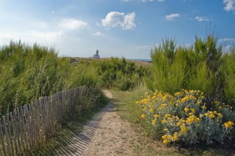 A walking pathway to the lighthouse. Stock Photos
