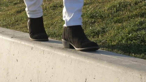 Walking on pavement in the fall lady in dress shoe 4k Stock Footage 97424924