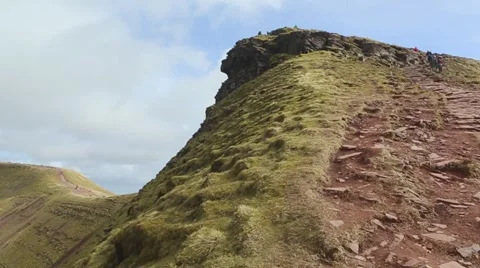 Walking to the peak of Pen Y Fan mountain, Wales, in slow motion. Stock Footage
