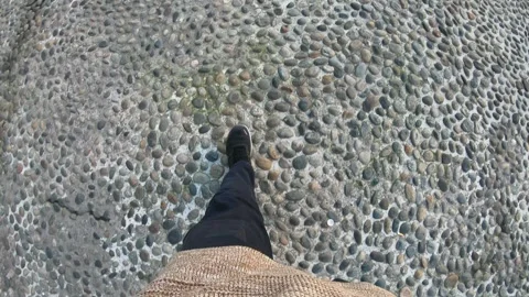 Walking on a Pebbled Pathway Stock Footage 314786934