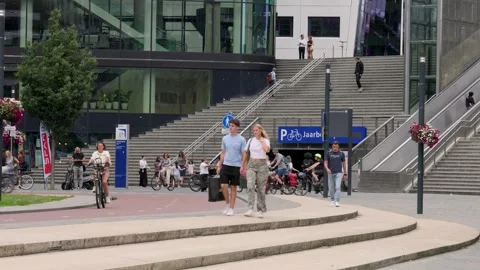 Walking people in front of the central train station in Utrecht Stock Footage 339581848