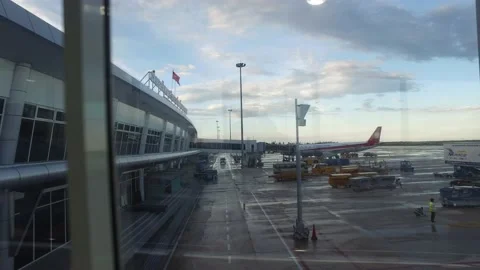 Walking from the plane corridor to inside Cam Ranh International airport Stock Footage 130903003
