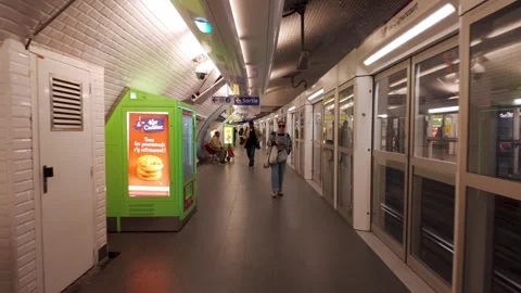 Walking On The Platform At A Station On The Paris Metro System, Rapid Transit Stock Footage 321735548