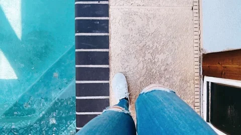 Walking by pool, poolside view, pool footsteps, pool reflection, walking Stock Footage 291746640