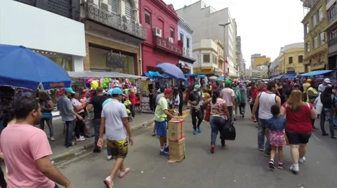 Walking on the popular commerce in Rua 25 de Marco (25 March Area). Stock Footage 45422907