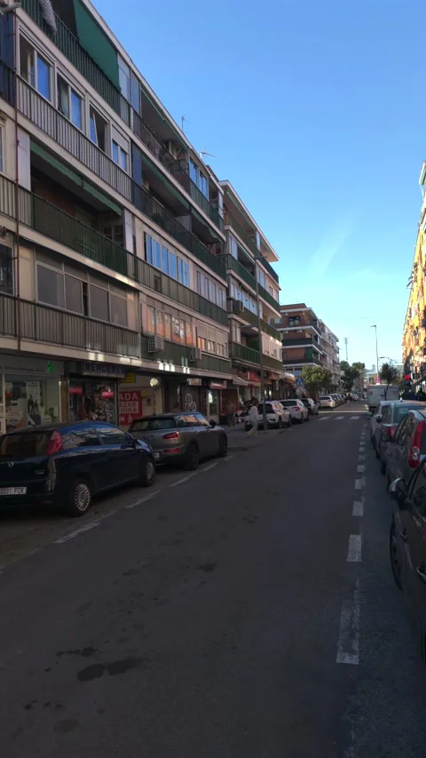 Walking pov down a quiet urban street in a european city Stock-Footage 329510152