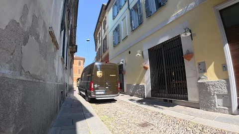 Walking POV through a narrow historic Italian street with UPS delivery van Stock Footage 346800374