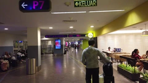 Walking POV Tracking Passenger with Suitcase at Kuala Lumpur International Stock Footage 342296708