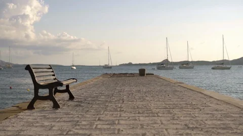 Walking on the quay at sunset, Full HD Slow motion, wide shot Video stock 128646975
