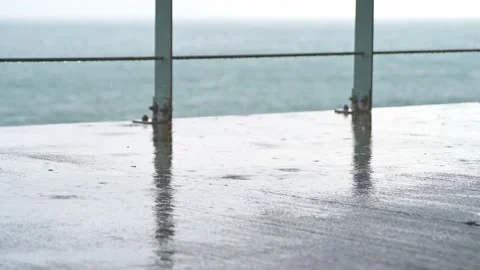 Walking by railing on a rainy day Video stock 131318544
