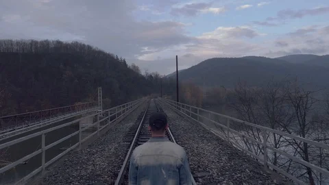 Walking on the railway bridge 库存影片 119596196