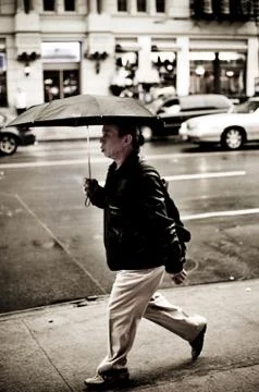 Walking in the Rain in NYC Stock Photos