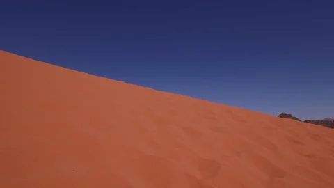 Walking on the red sand dune of Wadi Ram. Jordan. DJI-0518-01 스톡 동영상 102500209