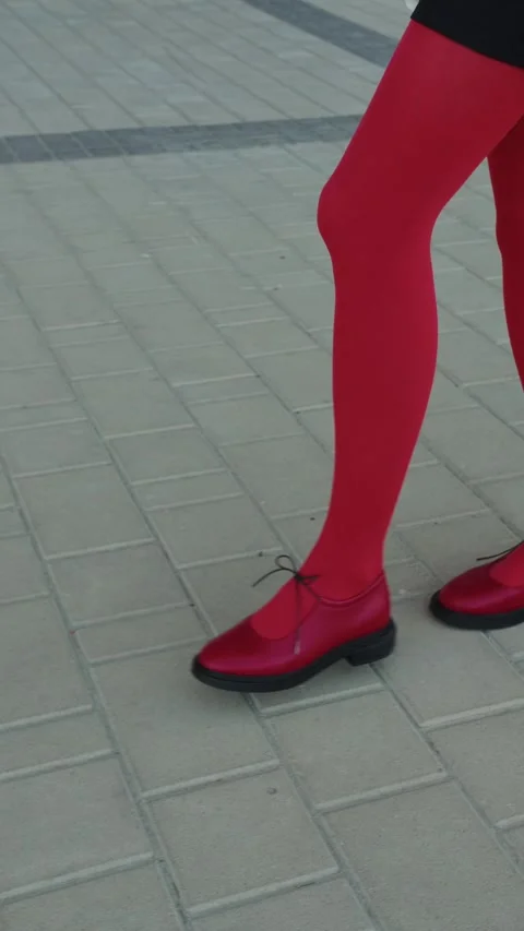 Walking in red tights and strap shoes on pavement Stock Footage 307054720