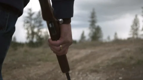 Walking With Rifle in Hand Stock Footage 128071228