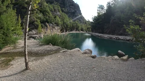 Walking into river and mountain 스톡 동영상 219856291