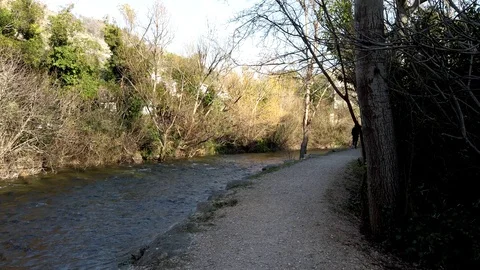 Walking by the river stream on a sunny day Video stock 103103918