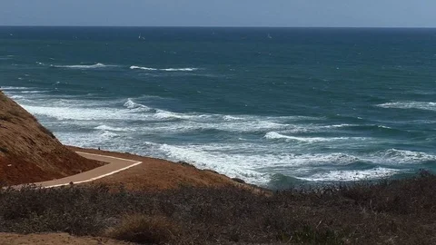Walking road on the background of the sea and waves. Mediterranean sea Israel Stock Footage 123557547