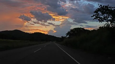 Walking on the road before it gets dark Stock Photos