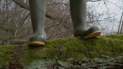Walking in rubber boots in the forest. Stepping on moss Stock Footage 305268989