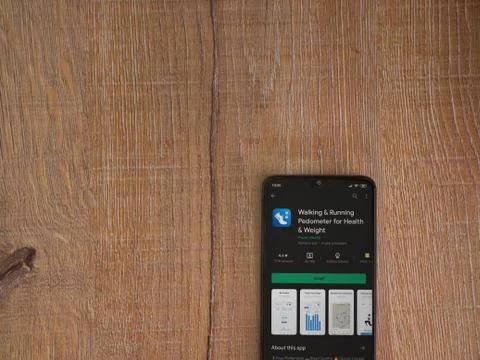 Walking &amp; Running Pedometer app play store page on the display of a black mob Stock Photos