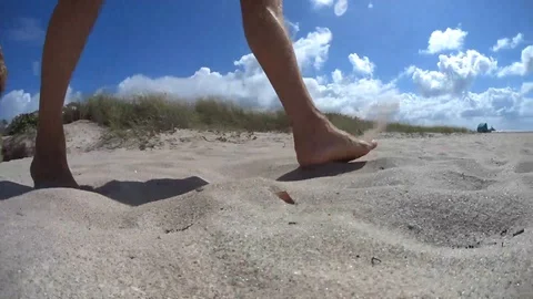 Walking in sand Stock Footage 129855902