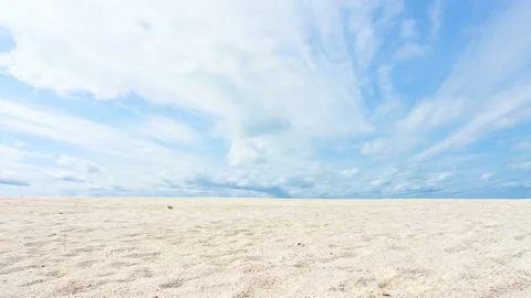 Walking scene on the sandy beach with blue sky in the background. Stock Footage 156990728