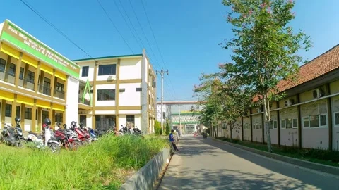 Walking in the school complex to the parking lot Stock Footage 243067833